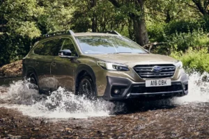 Subaru Outback driving in the river